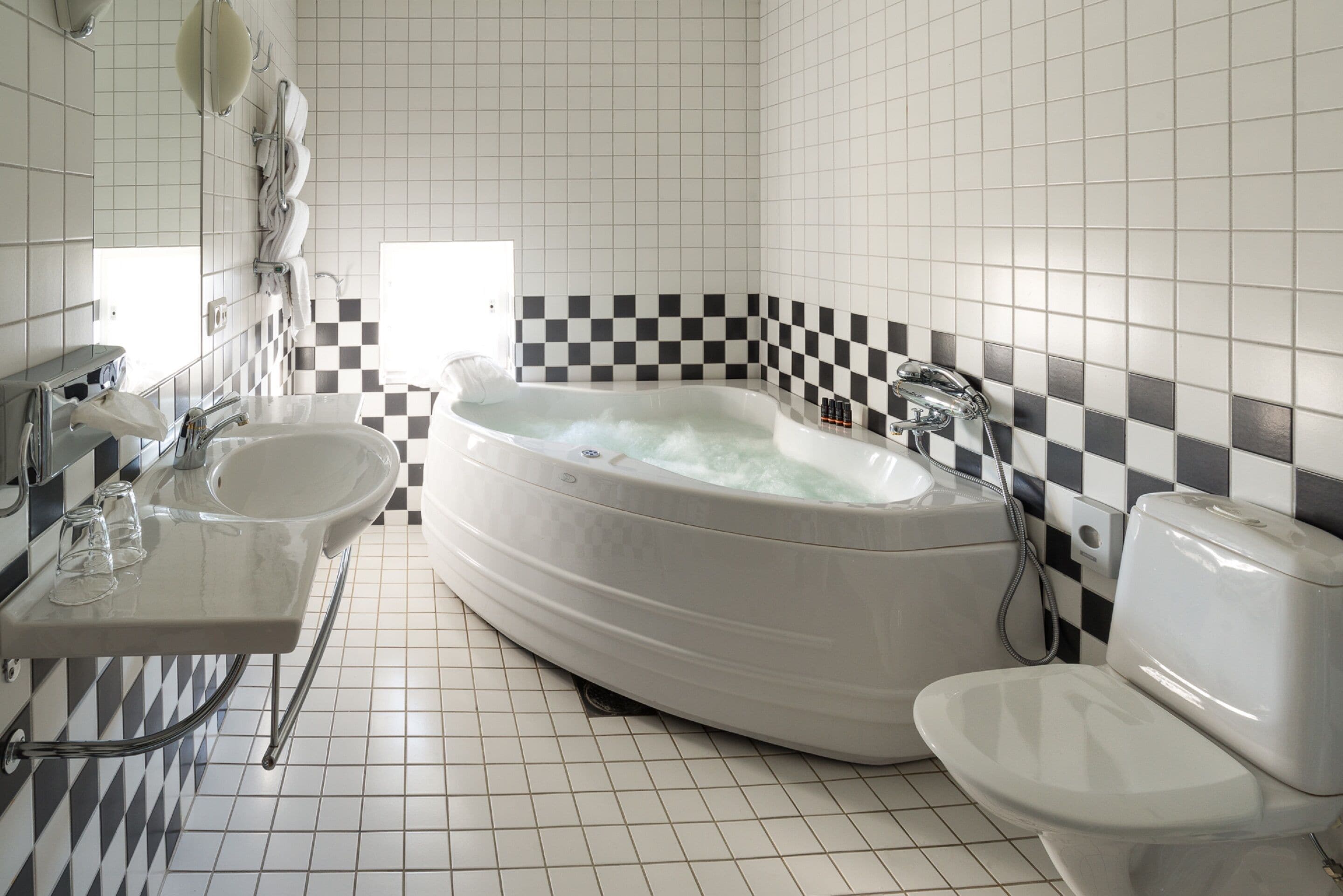 deluxe room (jacuzzi) | bathroom | hair dryer, heated floors, towels, soap