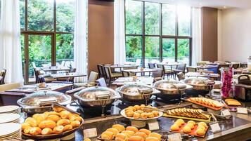 Indulge in a diverse spread of pastries, bread, and baked goods at our buffet.