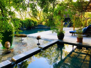Outdoor pool, pool umbrellas, sun loungers