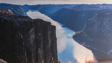 A mountainous landscape with a river.