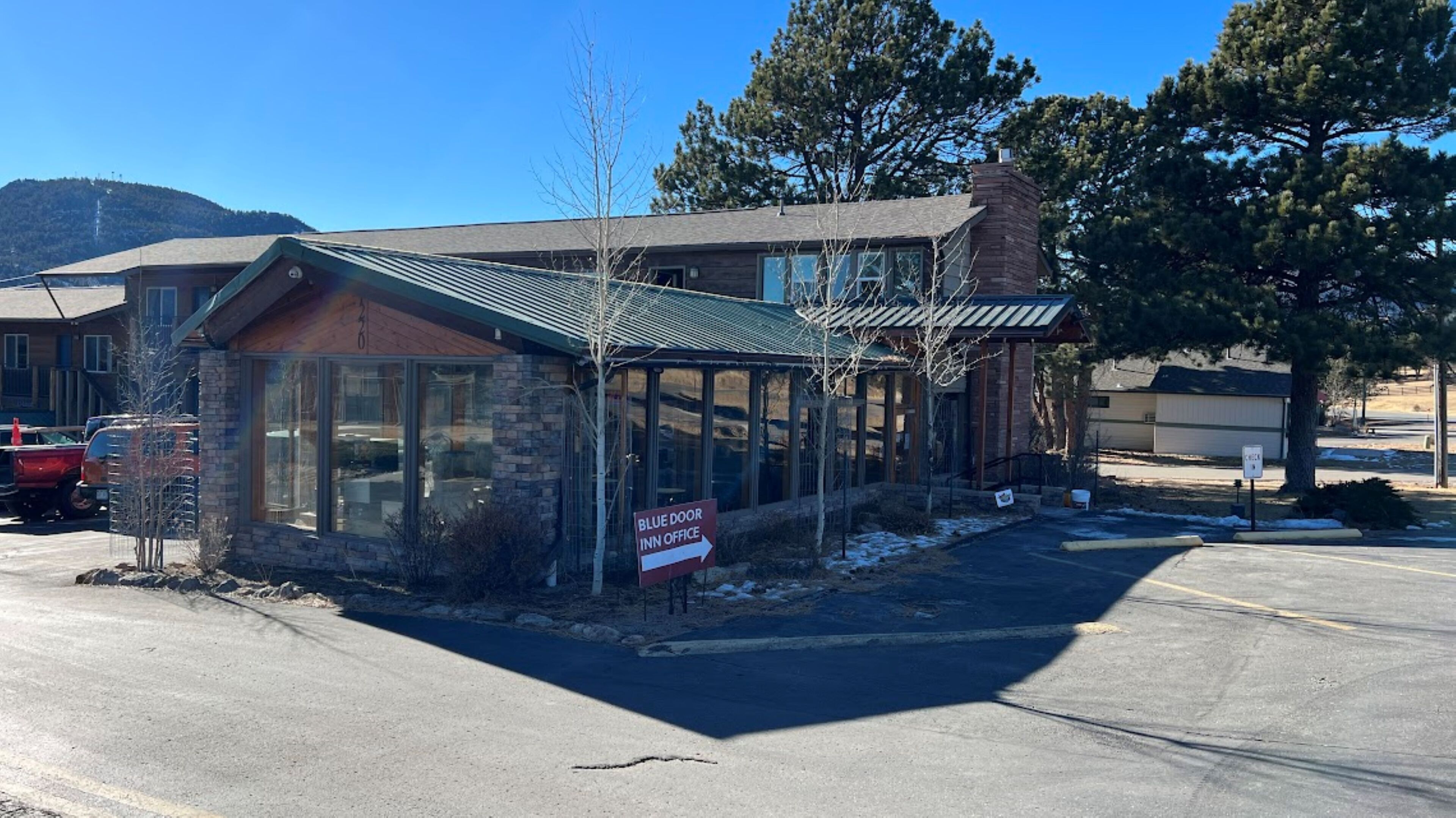 A building with a sign indicating a Blue Door Inn Office.