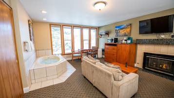 Premium Studio Suite | Premium bedding, desk, blackout drapes, iron/ironing board