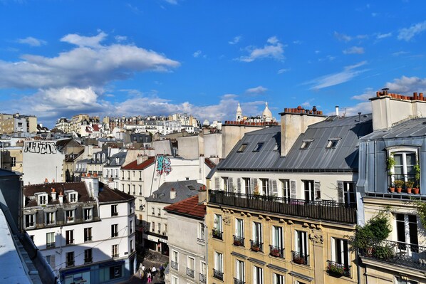 A cityscape with historic buildings, including a prominent dome structure.