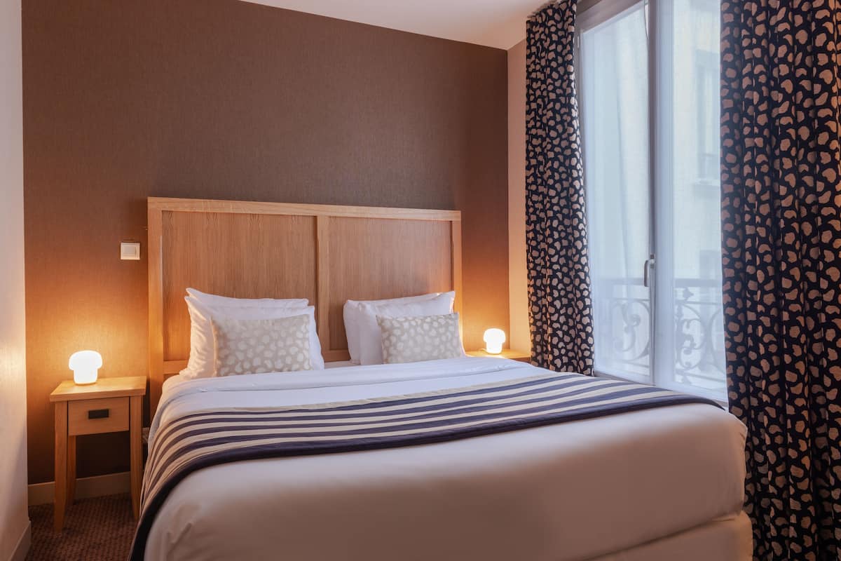 Habitación doble | Ropa de cama de alta calidad y minibar