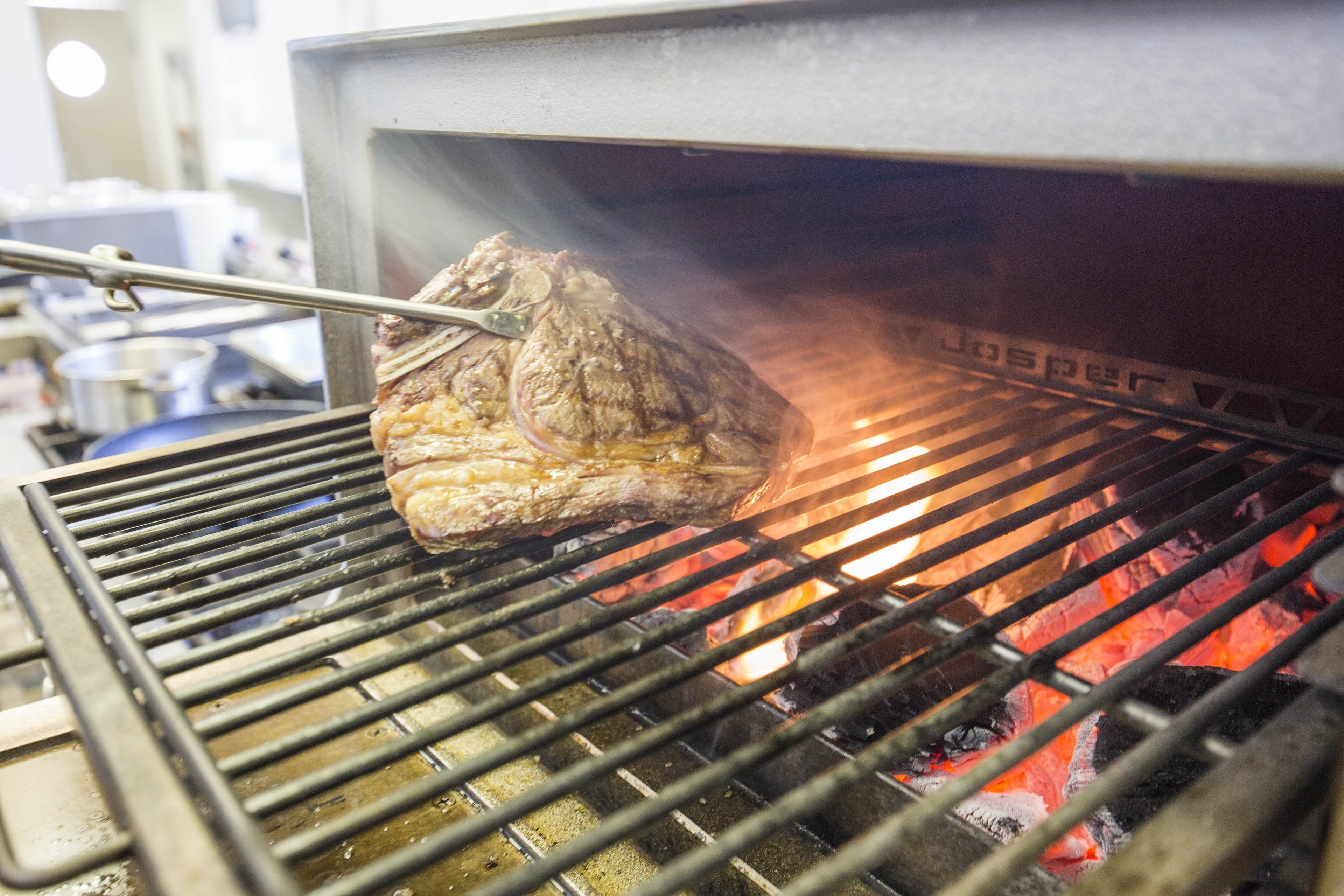 A large roast cooking in an oven.