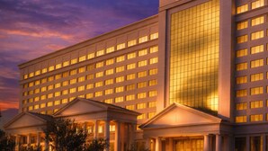 A large hotel with a prominent 'Caesars' sign, multiple floors, and a symmetrical facade. - Caesars Southern Indiana Hotel & Casino - A Caesars Rewards Destination (Elizabeth)