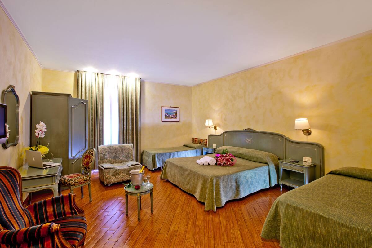 Family Room | Hypo-allergenic bedding, minibar, in-room safe, cribs/infant beds