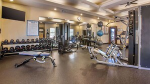 A gym with various exercise equipment, including dumbbells, a bench, and weight machines. - Hilton Vacation Club Sedona Summit (Sedona)