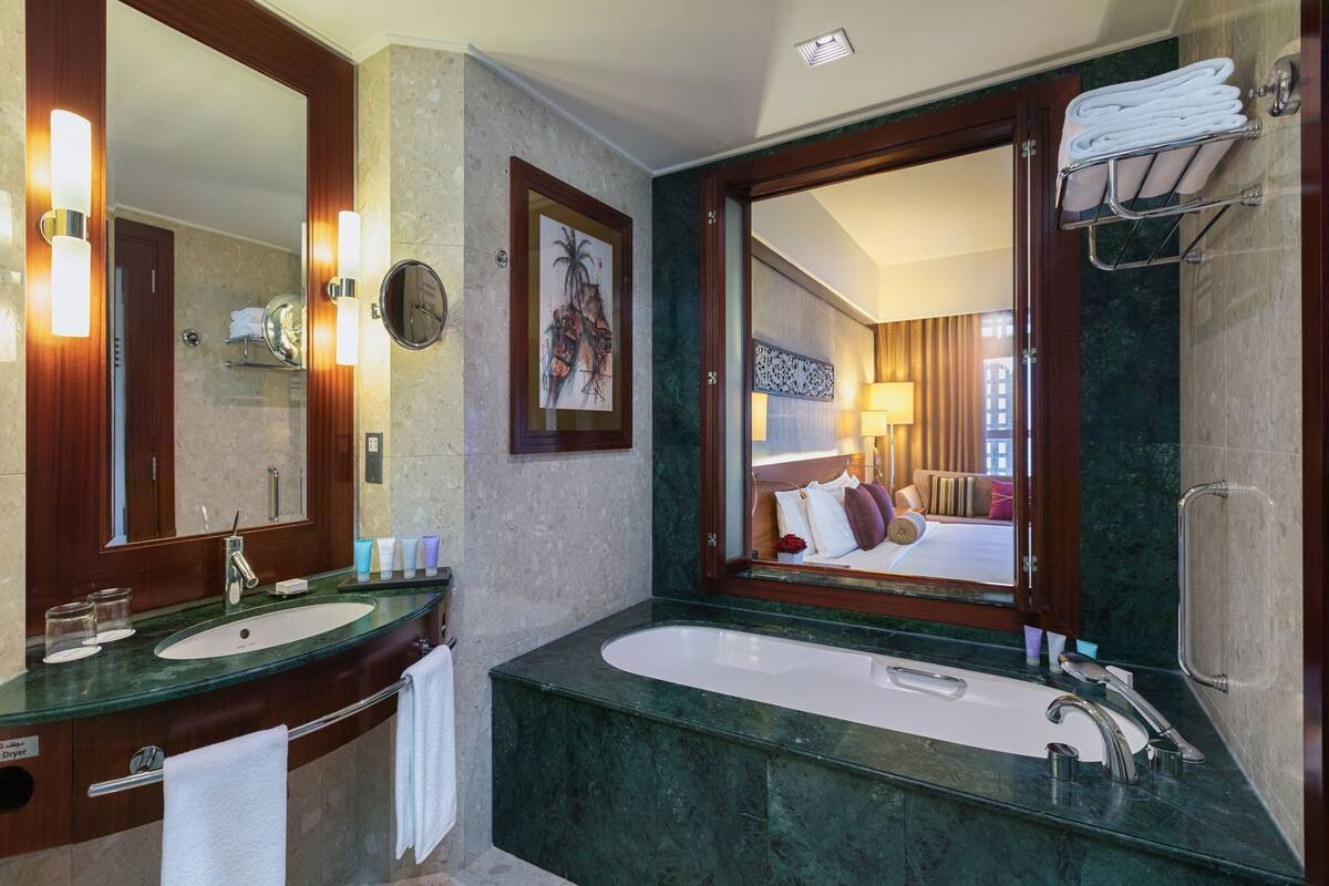Bathroom | Separate tub and shower, free toiletries, hair dryer, bathrobes