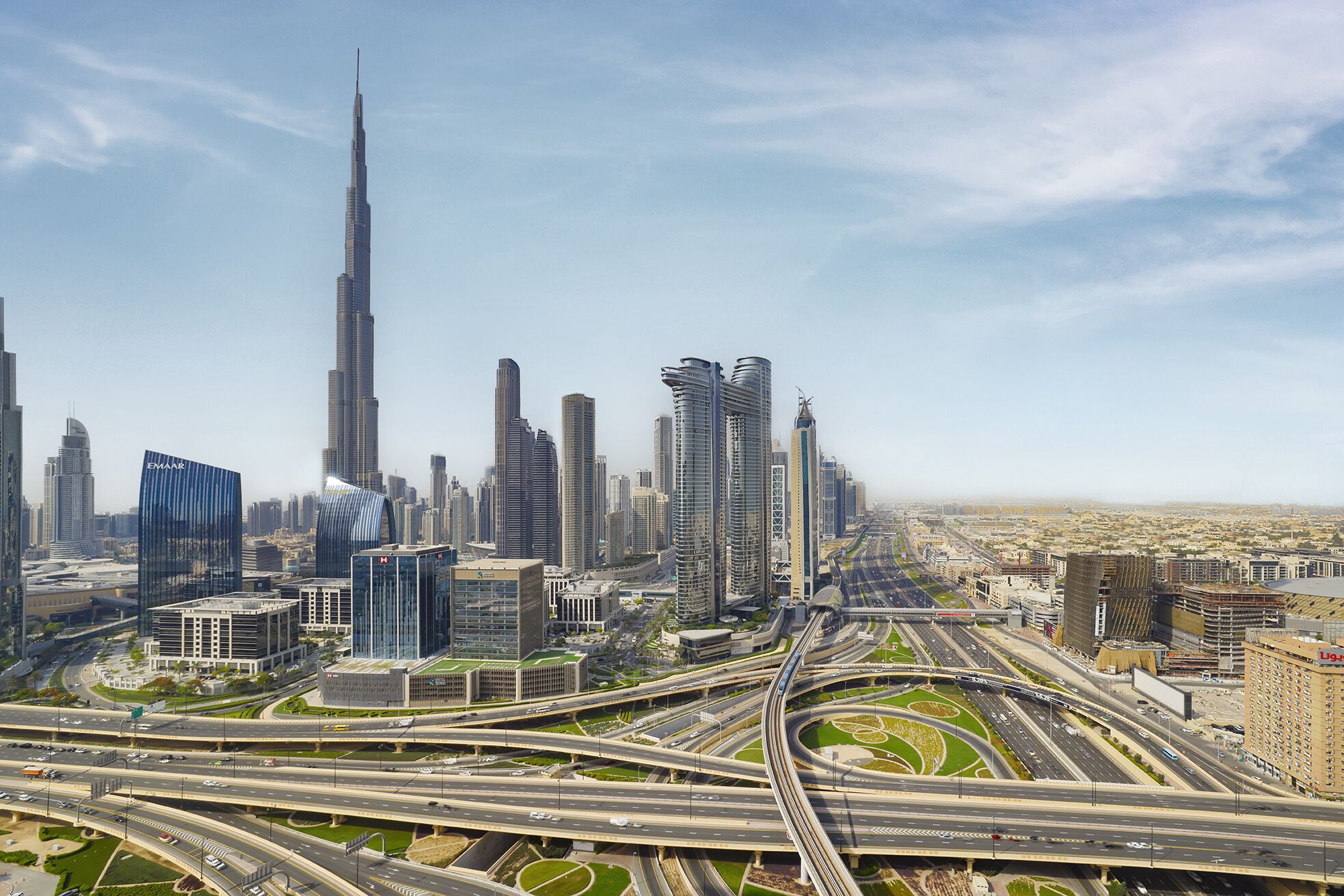 A cityscape with multiple high-rise buildings, including a prominent skyscraper.