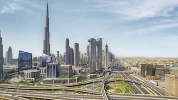 A cityscape with multiple high-rise buildings, including a prominent skyscraper.