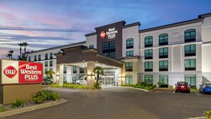 A Best Western Plus hotel with a modern facade, multiple windows, and a parking area. - Best Western Plus McAllen Airport Hotel (McAllen)
