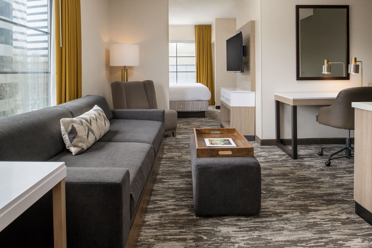 Suite, 1 King Bed, Non Smoking, Corner | Desk, laptop workspace, blackout curtains, iron/ironing board