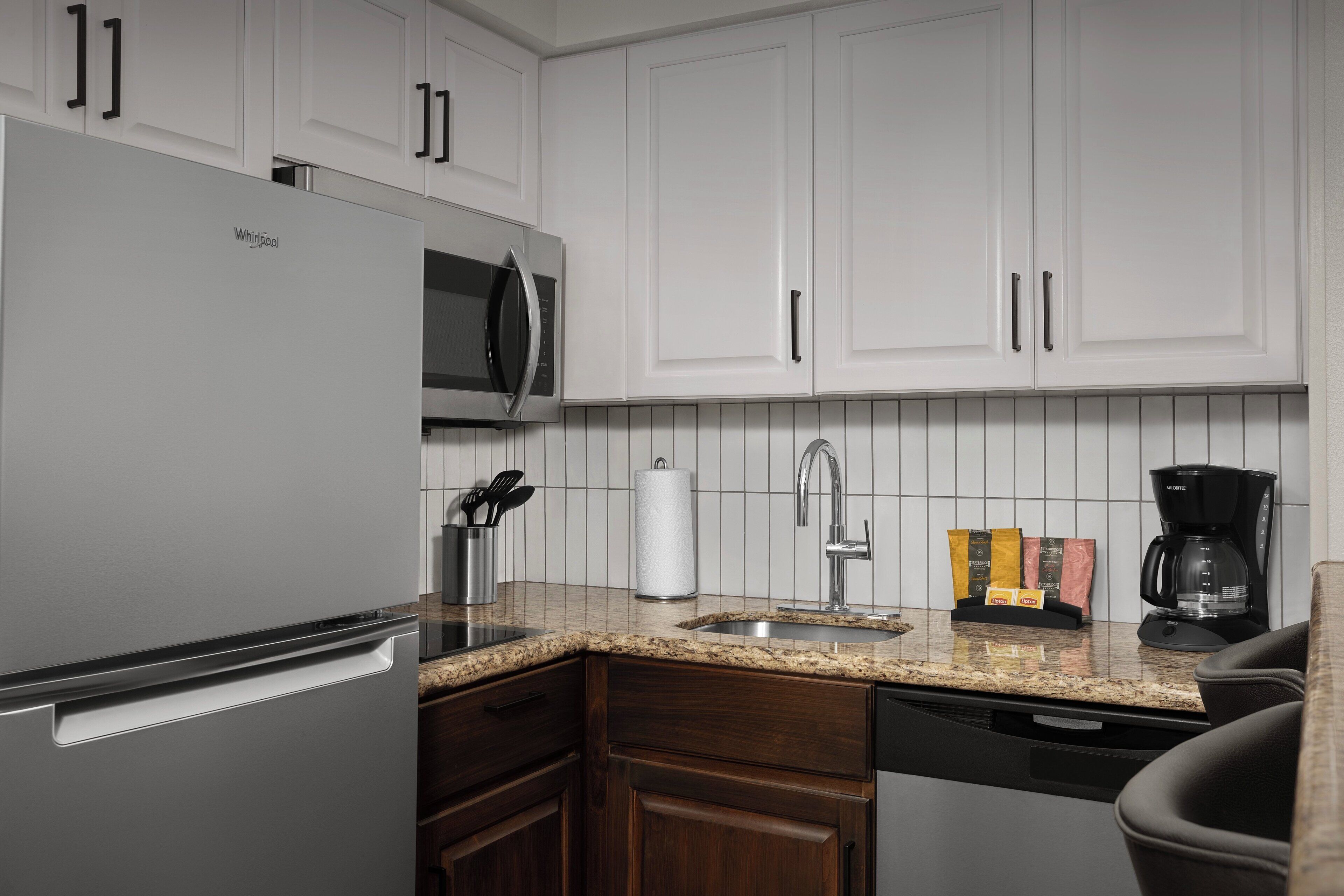 full-sized fridge, microwave, stovetop, dishwasher