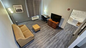 Suite, 1 King Bed, Non Smoking, Jetted Tub | Living area | TV