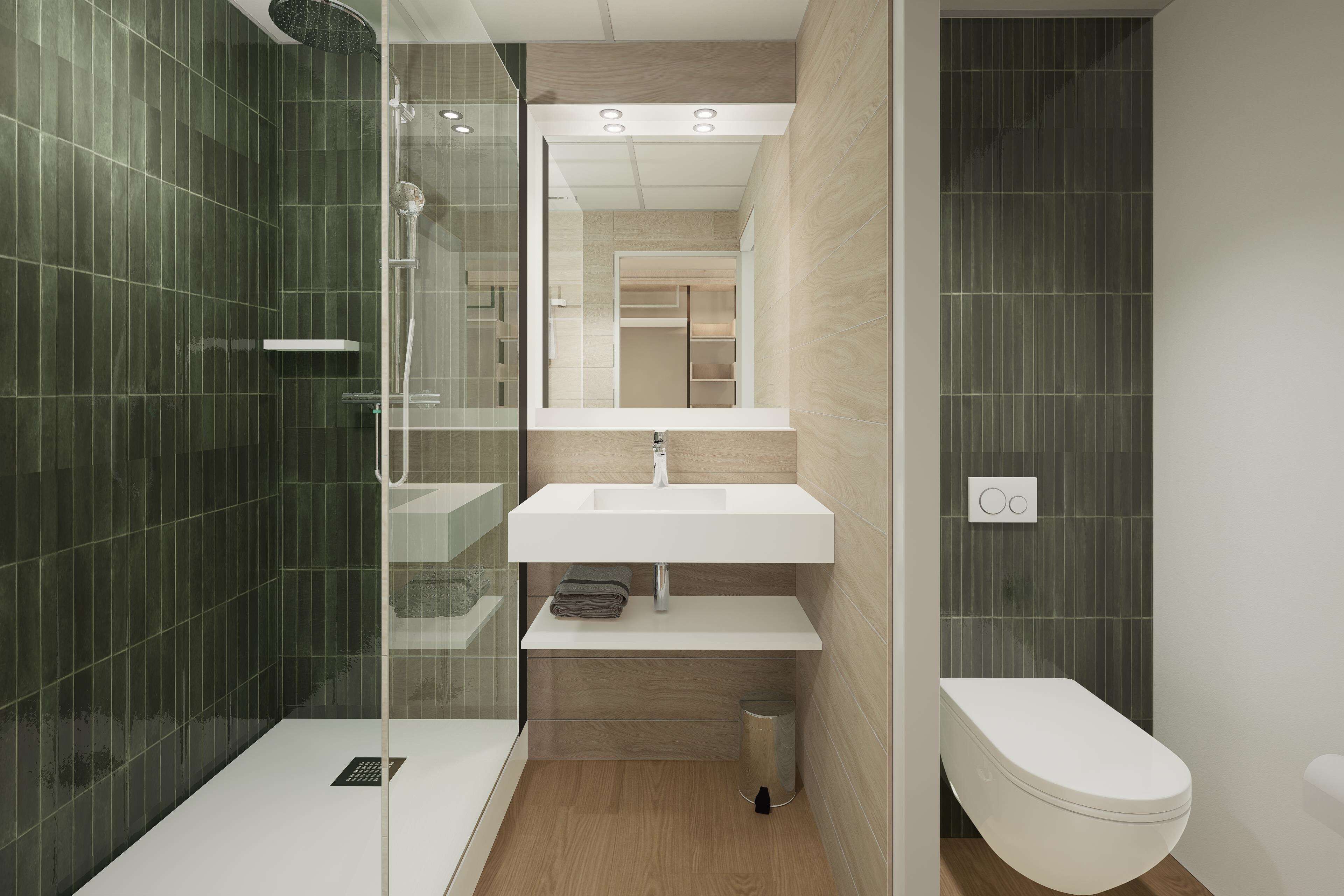 A modern bathroom with a glass-enclosed shower, a white sink, and a toilet.