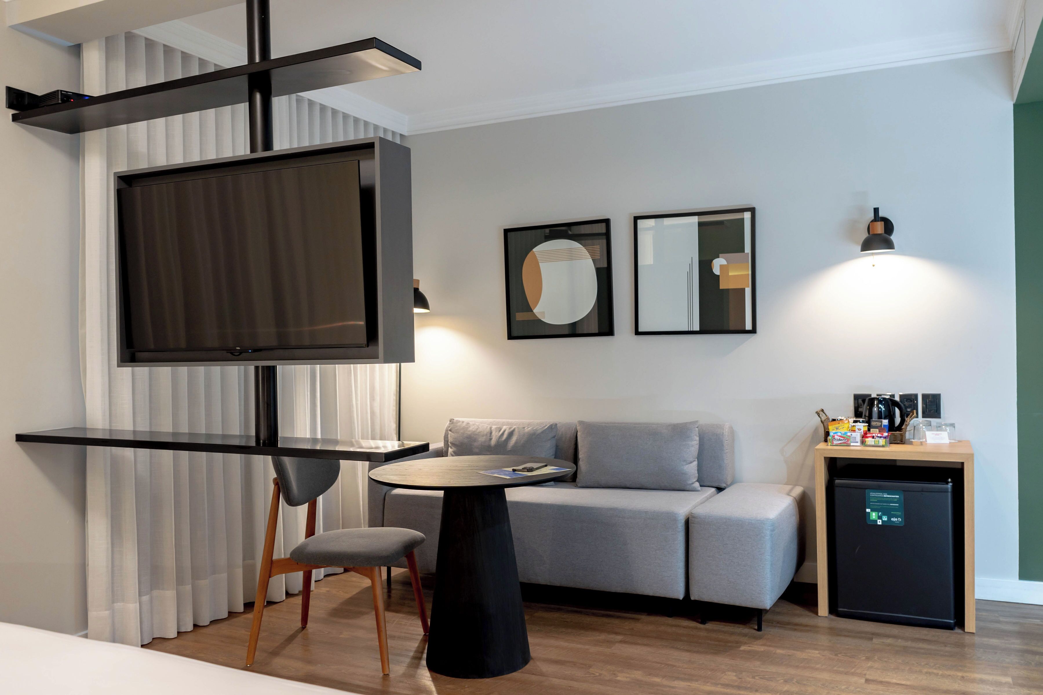 luxury suite, 1 king bed with sofa bed | living area | 32-inch lcd tv with cable channels, tv