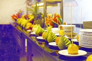 A buffet with various fruits and vegetables arranged on plates. - Gafy Resort Aqua Park (Sharm El Sheikh)