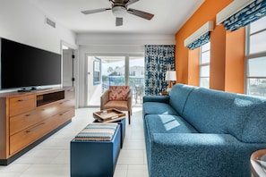 1 Bedroom King Plus Suite Partial Ocean View | Living area | 32-inch flat-screen TV with satellite channels, TV