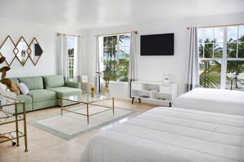 Premium Studio Suite, 2 Queen Beds | In-room safe, desk, laptop workspace, iron/ironing board at Beach Park Hotel