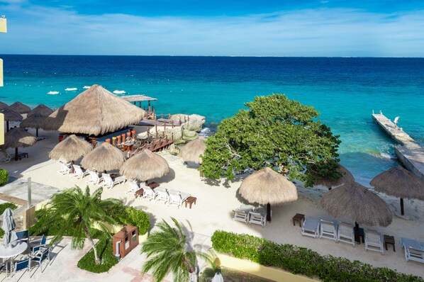 Private beach, white sand, sun loungers, beach umbrellas