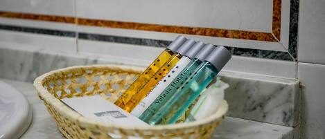 A wicker basket containing toiletries on a bathroom counter.