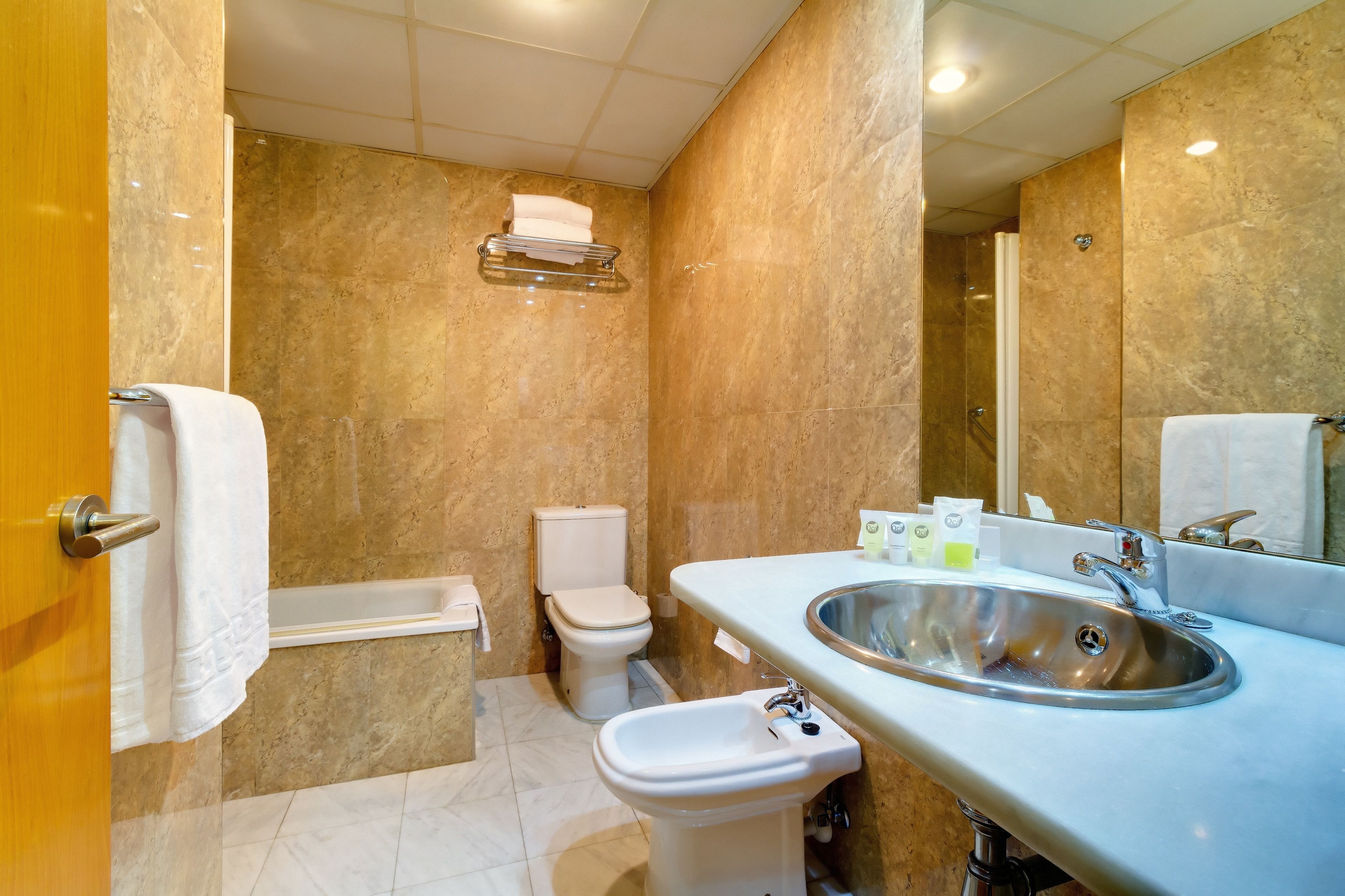 bathtub, hair dryer, towels