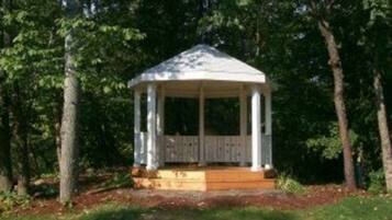 Situated in a wooded environment, this elevated gazebo offers a tranquil vantage point.