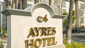 A sign for the Ayres Hotel with a prominent logo and the name of the hotel. - Ayres Hotel Anaheim (Anaheim)