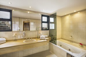 Studio Suite | Bathroom | Combined shower/tub, spring water tub, rainfall showerhead