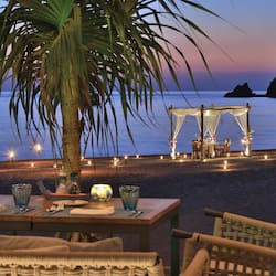 On the beach, white sand, sun-loungers, beach umbrellas