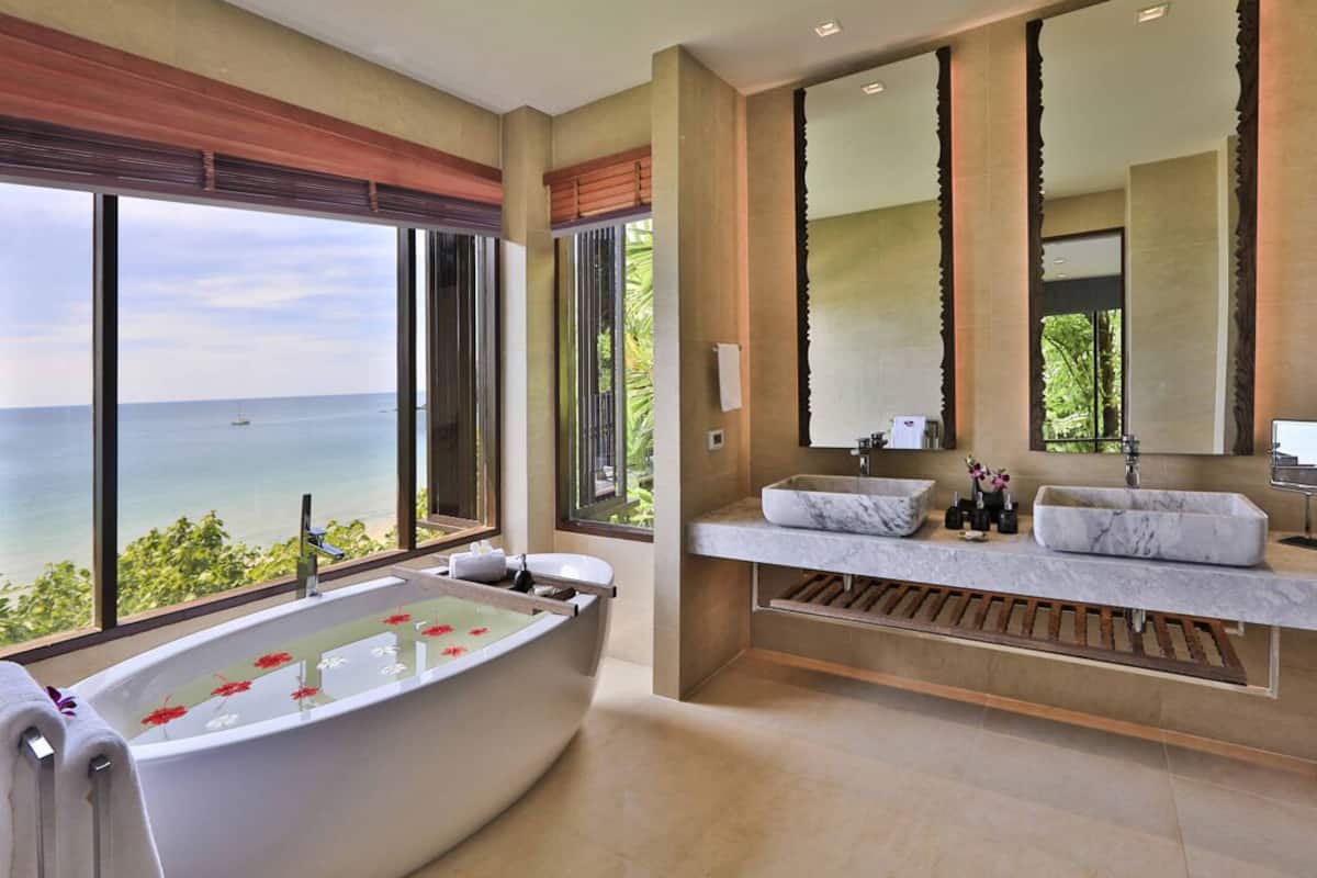 bayfront deluxe room | bathroom | separate bathtub and shower, designer toiletries, hair dryer, bathrobes