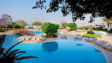 Indoor pool, 3 outdoor pools, open 8:00 AM to 8:00 PM, pool umbrellas