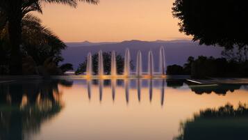 Indoor pool, 3 outdoor pools, open 8:00 AM to 8:00 PM, pool umbrellas