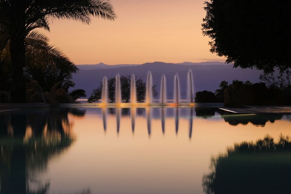 Indoor pool, 3 outdoor pools, open 8:00 AM to 8:00 PM, pool umbrellas