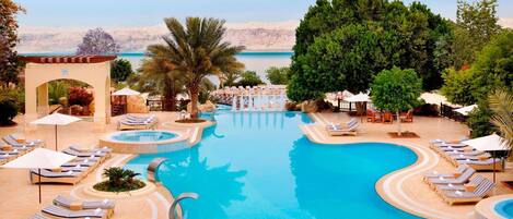 Indoor pool, 3 outdoor pools, open 8:00 AM to 8:00 PM, pool umbrellas