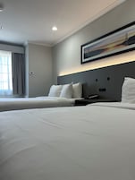 Standard Room, 2 Queen Beds, Non Smoking | In-room safe, desk, blackout drapes, iron/ironing board