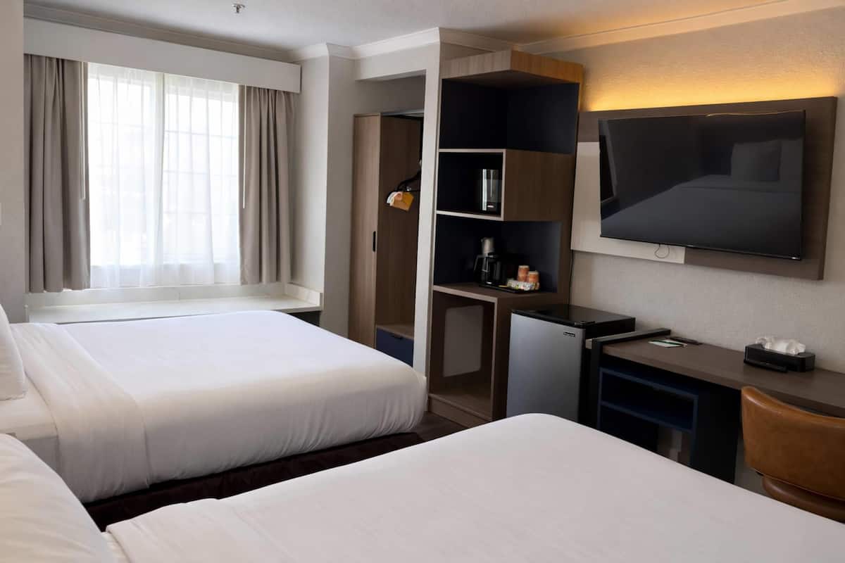 Standard Room, 2 Queen Beds, Non Smoking | In-room safe, desk, blackout drapes, iron/ironing board