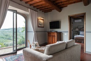 Panoramic Suite, Garden View | Living area | 32-inch flat-screen TV with satellite channels, TV