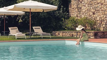 Seasonal outdoor pool, open 9:00 AM to 7:30 PM, pool umbrellas