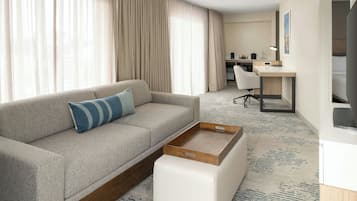 A modern hotel room with a sofa, a desk, a chair, and a large window with curtains.