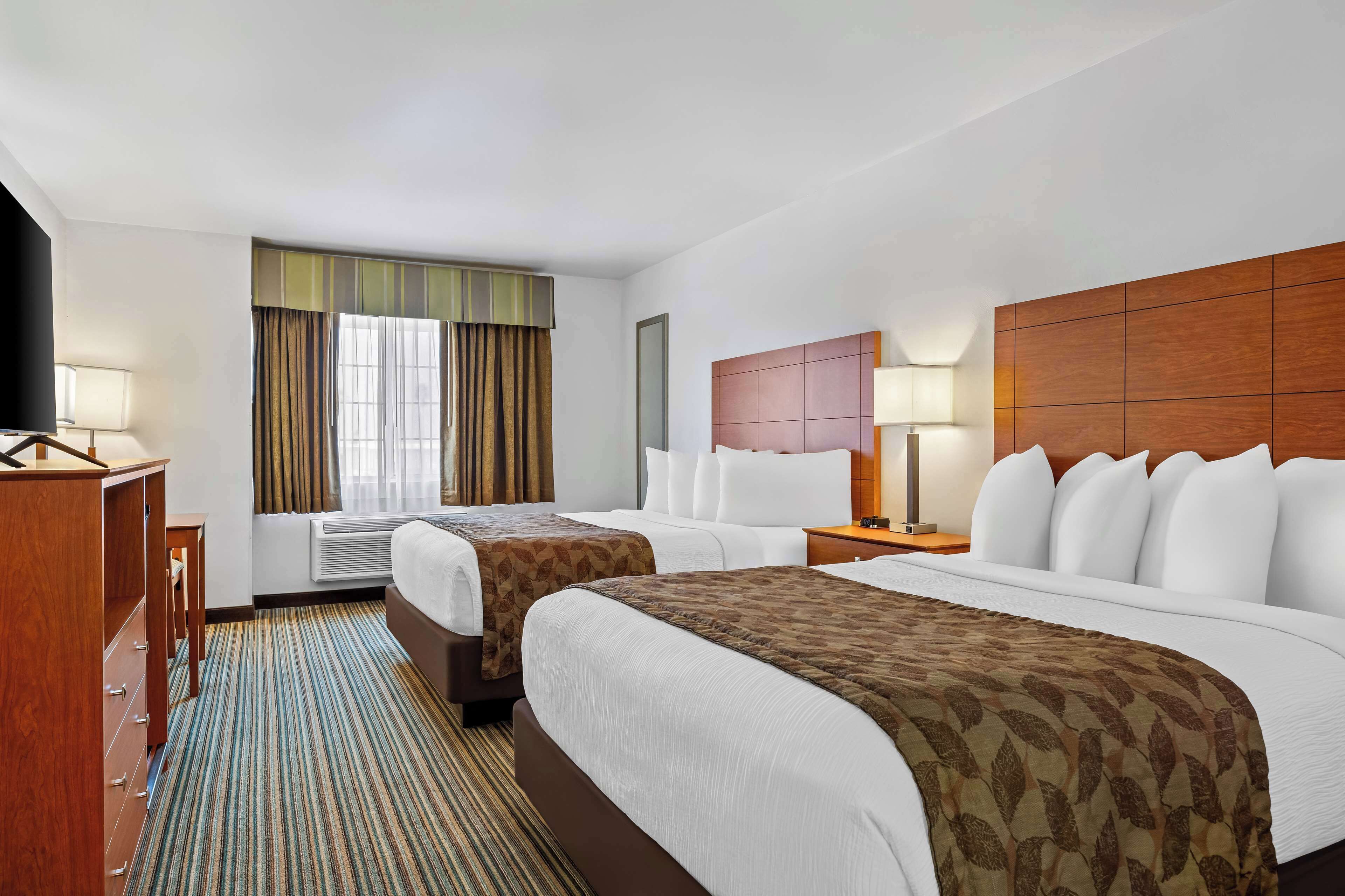 standard room, 2 queen beds, non smoking, refrigerator & microwave | desk, iron/ironing board, cots/infant beds, wifi