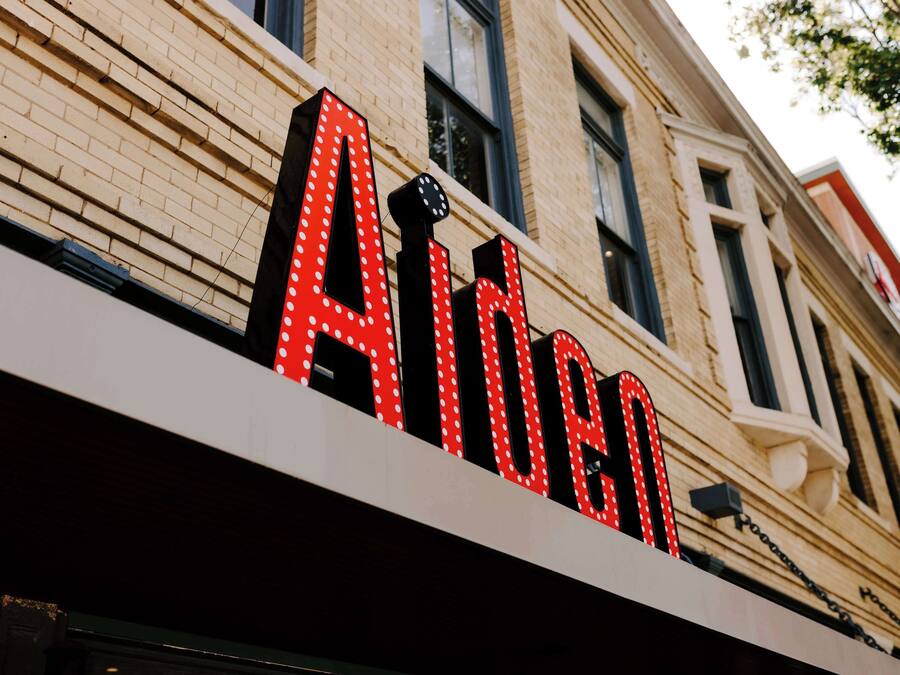 A building with a sign that reads "Aldan."
