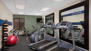 A gym with treadmills, elliptical machines, and exercise balls. - Hampton Inn Phoenix/Anthem (Phoenix)