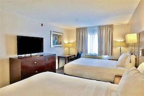 A hotel room with two beds, a TV, a desk, and a chair. - Comfort Inn & Suites - Tucson Airport (Tucson)