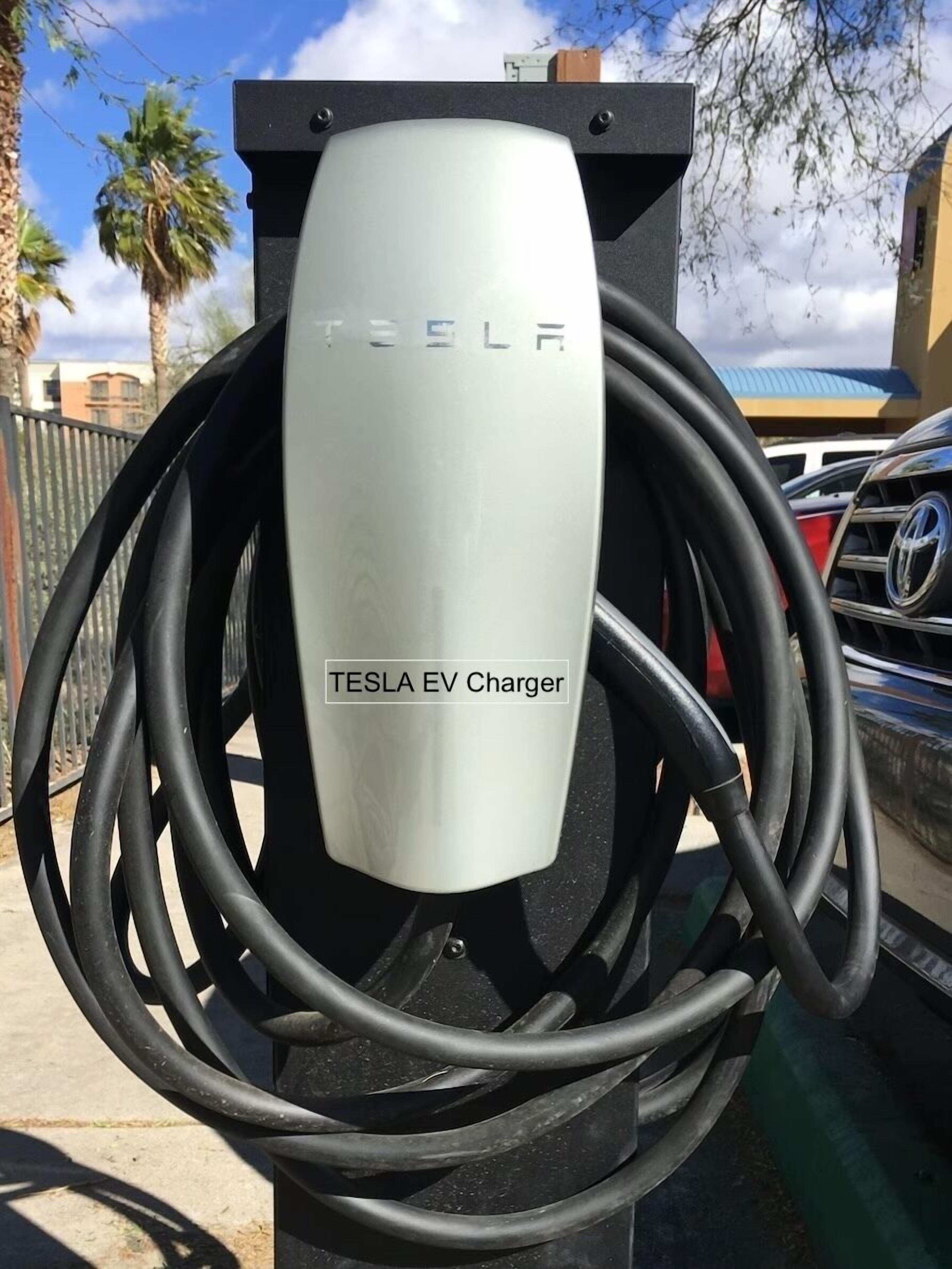 A Tesla EV Charger with multiple charging cables.