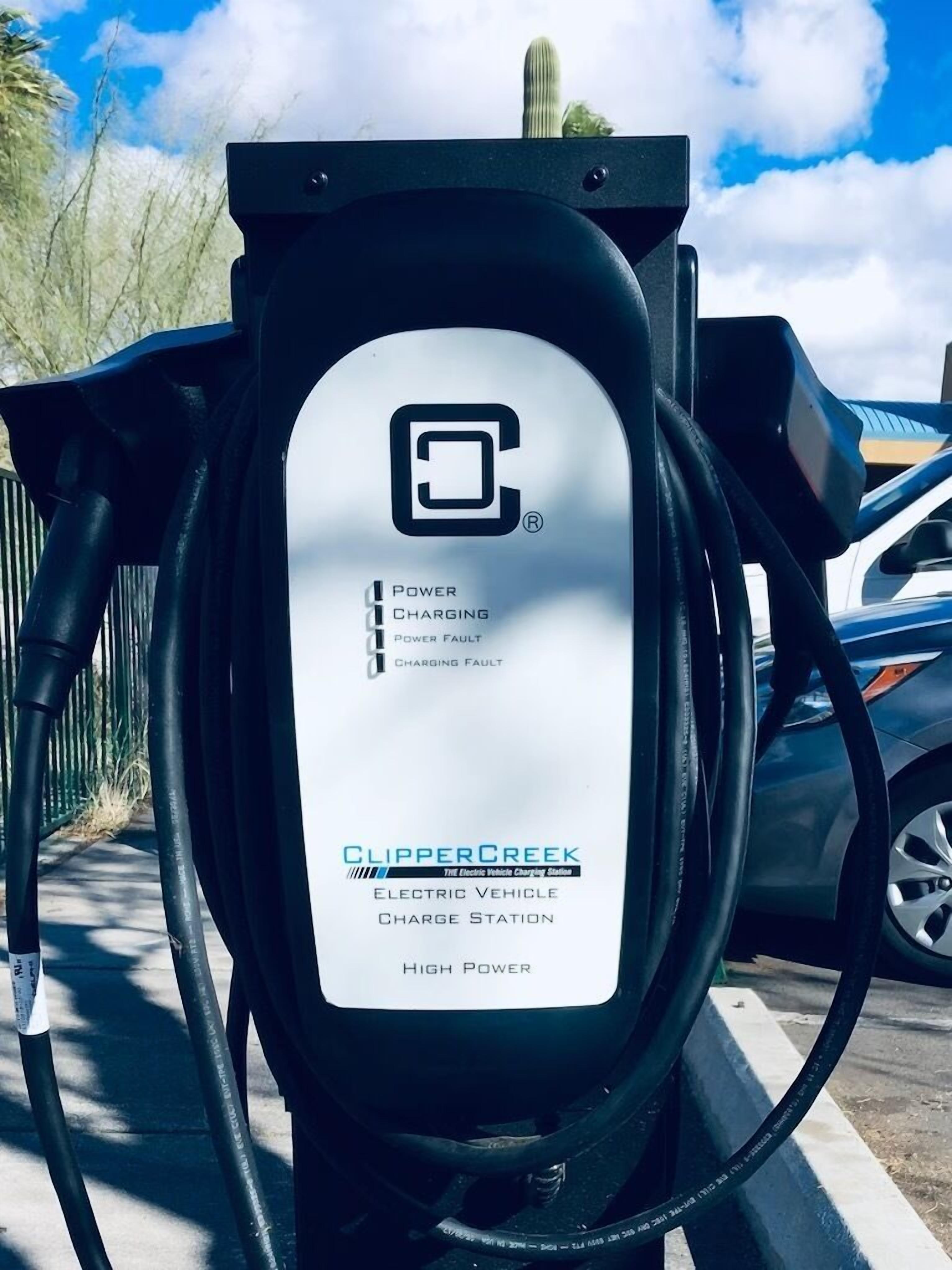 An electric vehicle charging station with a label indicating it is a high-power station.