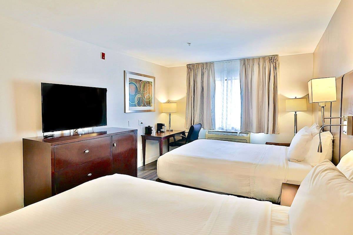 Room, 2 Queen Beds, Non Smoking | In-room safe, desk, laptop workspace, blackout drapes