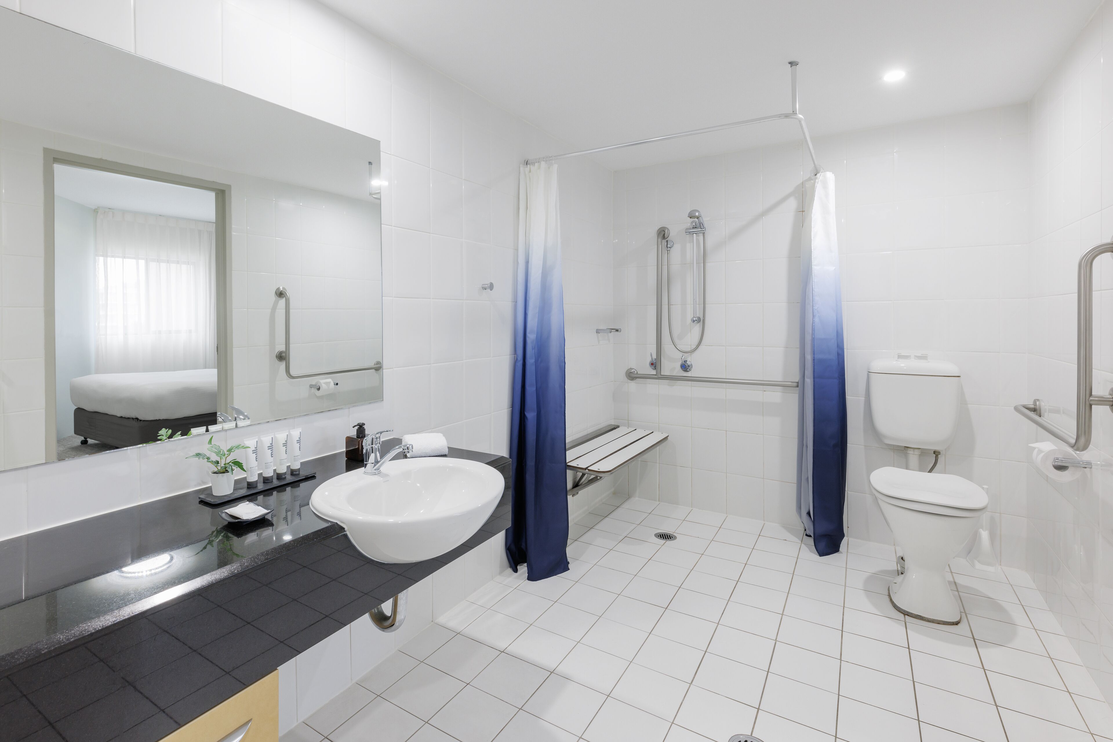 accessible studio apartment | bathroom | combined shower/bathtub, hair dryer, towels