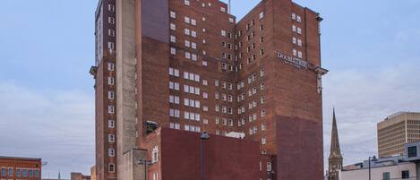 A multi-story brick building with a prominent sign reading "DOWNTREE."